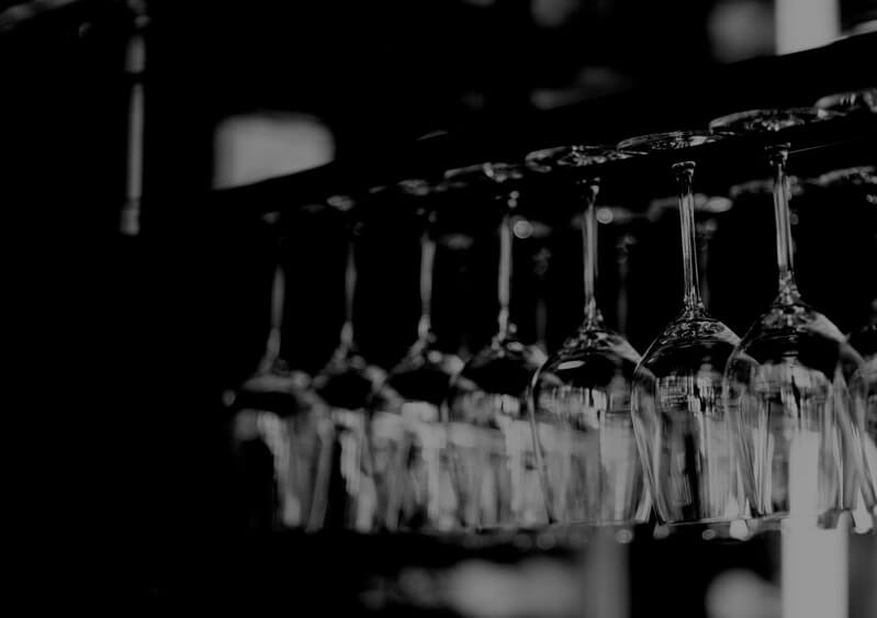 upside down lined up wine glasses